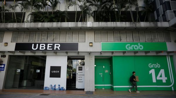 Vi phạm luật cạnh tranh Grab và Uber bị phạt 13 triệu SGD